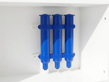 Minimalist modern pool filter system installed in a clean white utility room, sharp focus, high-key lighting