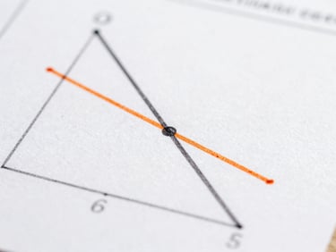 Macro close-up of a hand-drawn geometric rate-of-change diagram on white paper, showing tangent lines and secant approximations, crisp technical style, slate ink and orange accent lines.