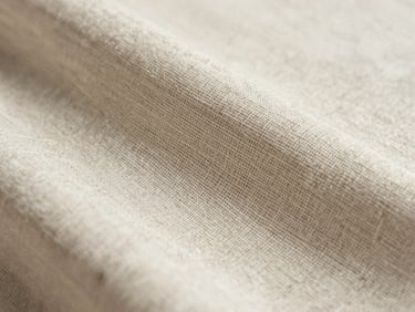 Macro crop of pristine natural linen fabric texture, soft daylight, neutral tones.