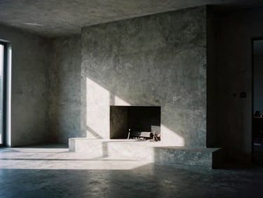 Wide-angle interior of a brutalist living room with a custom concrete hearth and deep shadows, 35mm film