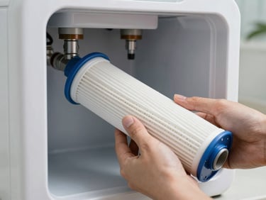 Hands replacing a sediment filter cartridge in a modern RO water purifier system