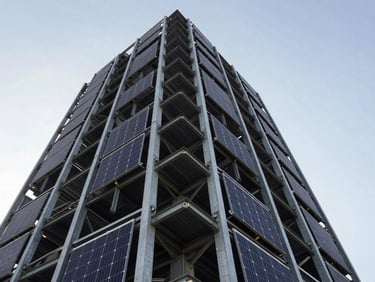 Low-angle heroic shot of high-rise commercial rooftop solar panels integrated into steel framing, high-contrast industrial lighting