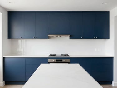 Straight-on architectural photo of a modern kitchen remodel, bright natural daylight, clean white countertops and navy blue cabinets, sharp focus