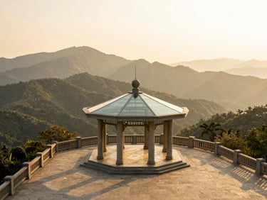 A majestic stone-and-glass pavilion terrace looking out over layered mountain ridges fading into a golden mist, low sun