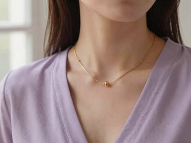 Elegant close-up of gold fine jewelry on a model, soft window light, warm editorial tone