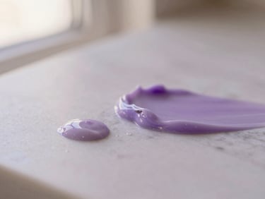 Intimate macro shot of clean skincare product textures on a marble surface, diffused natural lighting, soft shadows