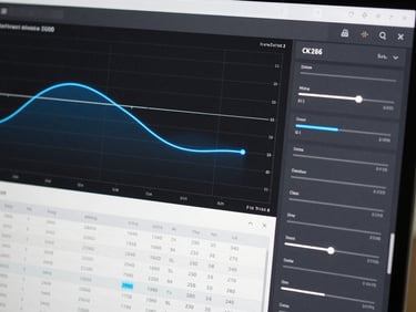 Interface screenshot of a web application showcasing a clean mathematical plot with electric blue curve lines, structured data tables, and input sliders on a dark slate background.