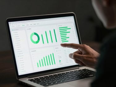 Close-up shot of a male entrepreneur analyzing clean data dashboards on a modern laptop screen, moody low-key studio lighting, electric green highlights, sharp focus.