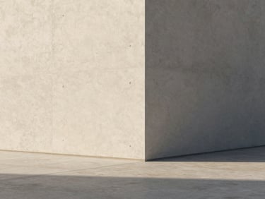 Minimalist architectural corner with clean concrete lines and soft morning sunlight casting long shadows, high-end editorial photography