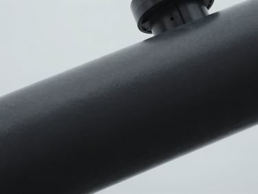 Extreme close-up of high-end industrial machinery components, sharp focus, 35mm, deep charcoal tones