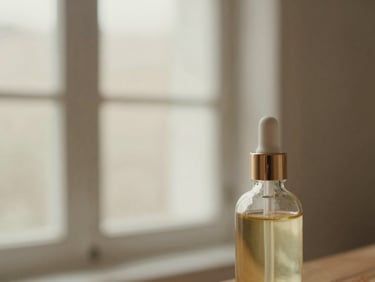 Macro detail of a luxurious skincare oil bottle, soft window light, neutral background, shallow depth of field.