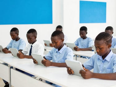 Bright editorial photography of West African students using digital tablets in a modern, clean classroom in Touba, natural daylight, vibrant sky blue accents, sharp focus.