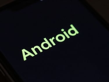 Macro close-up of a physical Android device screen displaying a minimalist text-only launcher, glowing neon green text on deep black background, low-key studio lighting