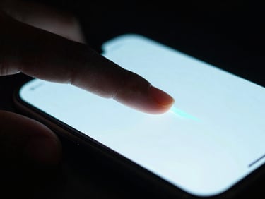 Extreme close-up of a finger swiping the edge of a clean smartphone screen, high-contrast cyan gesture path indicator glowing, moody backlighting