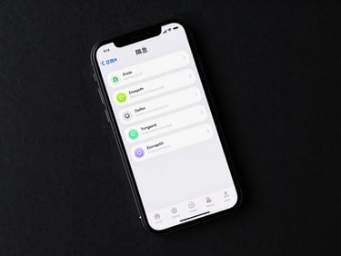 Top-down flat lay of a dark smartphone displaying a batched notification digest, crisp UI wireframe layout, sharp studio lighting, deep charcoal background