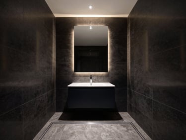 Modern luxury bathroom with immaculate dark tiling and precise linear drainage, warm accent lighting, 35mm lens