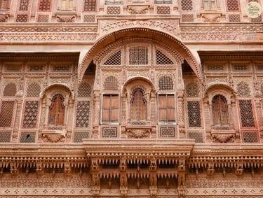 Delicate red sandstone lattice jharokhas of Jhanki Mahal at Mehrangarh Fort Jodhpur.