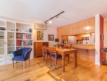 a dining room with a table and chairs