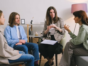 a group of people sitting around a table