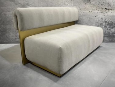 Modern bench with plush cream cushions and gold metal back, by Solo Home Decor.