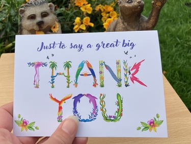 A greeting card with the words Just to say a great big Thank You printed in tropical exotic word art