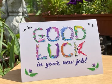 A greeting card with the words Good Luck in your new job printed in tropical exotic word art