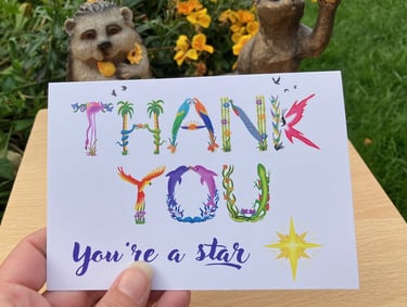 A greeting card with the words Thank You you're a star printed in tropical exotic word art