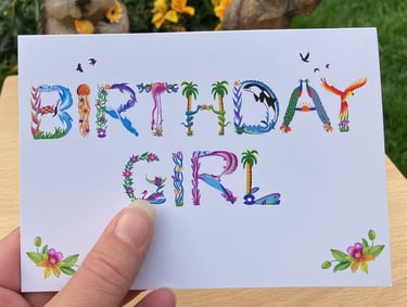 A greeting card with the words Birthday Girl printed in tropical exotic word art