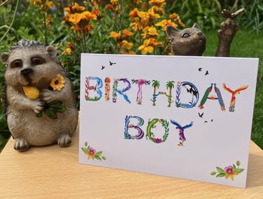A greeting card with the words Birthday Boy printed in tropical exotic word art