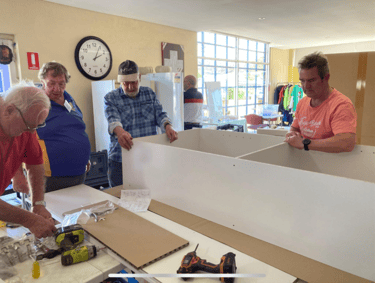 President Keith, Graham, Secretary Andrew, and Dave make sure the measurements are right.