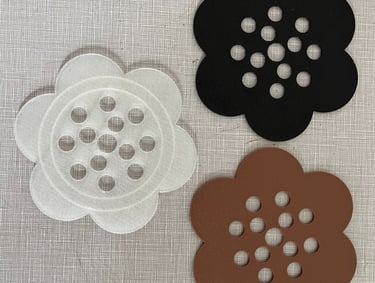 a clear, black, and brown 3d printed flower frog
