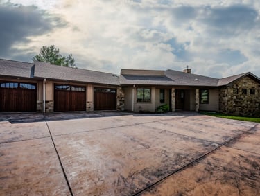 a house with a driveway and garage door