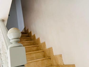 a staircase casement with a white wall and a white wall