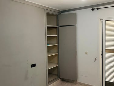 a room with a door and a closet