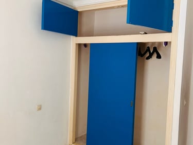 a blue door with a blue door and a pair of shoes