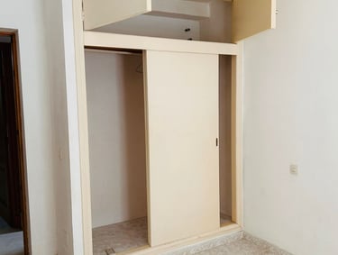 a room with a closet and a closet