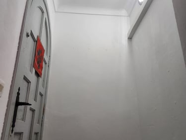 a door way with a red sign on it