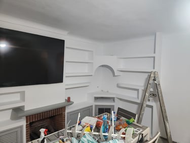 a television screen mounted on a wall in a room