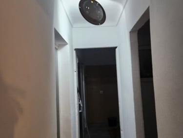 a clock on the wall of a hallway