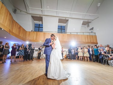 a bride and groom share a first dance at a wedding at Penarth Pier Pavilion