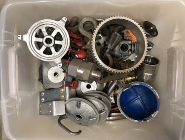 Metal parts in a sculptor's workshop bin, image 13.