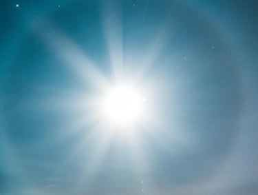 brilliant sun in blue sky