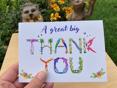 A greeting card with the words A great big Thank You printed in tropical exotic word art