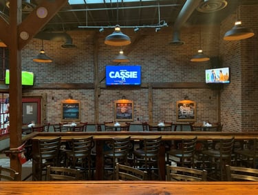 Trip TVs installed by At Hand Heroes in Glendale sports bar with reinforced mounts and hidden cords.