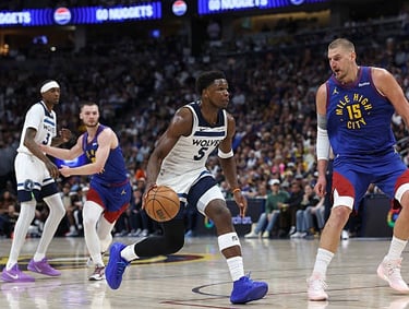 Anthony Edwards and Nikola Jokic during game 2 of the Wolves-Nuggets 1st round match-up (2026)