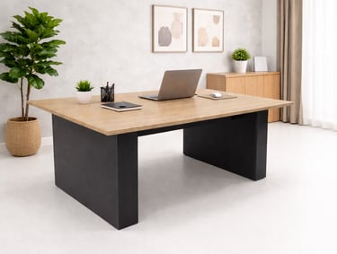 Modern wood and metal executive desk in a bright home office with a laptop and potted plants.