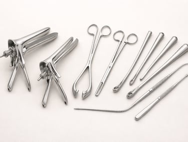 Gynecology instruments such as speculums, forceps, and probes on a white background.