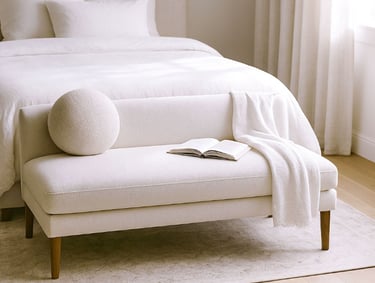 Compact linen settee in a cozy reading corner with natural shadows, a book, and a warm light atmosphere.