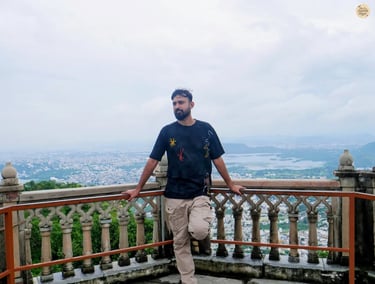 View of Udaipur town with shimmering lakes from hilltop Sajjangarh Monsoon palace Udaipur Rajasthan