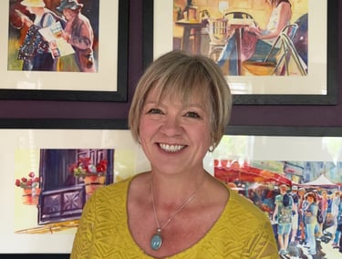 Deborah Lees infront of her paintings